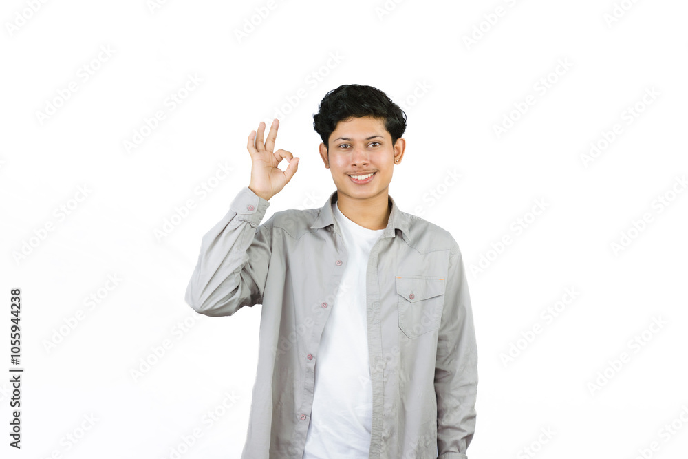 Young Teenager in shirt and vest gives expression of happiness and sadness points with gestures with hands Young Teenager in shirt and vest gives expression of happiness and sadness points with gestures with hands