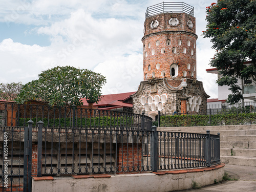 El Fortín de Heredia, icónica torre de ladrillo en el centro de Heredia, Costa Rica. Patrimonio cultural, símbolo de la ciudad y atractivo turístico en un entorno urbano. photo