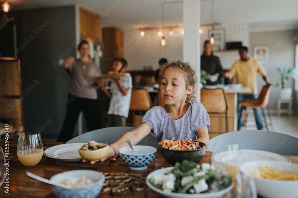 Cute girl keeping bowl on dining table for lunch at home Cute girl keeping bowl on dining table for lunch at home