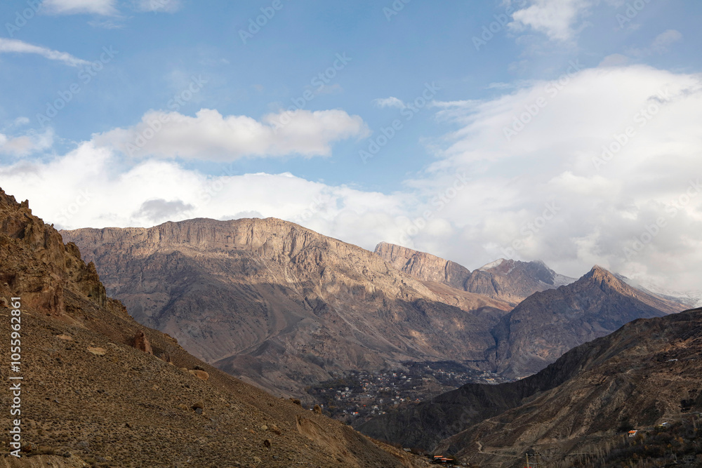 Cloudy sky over mountain range landscape Cloudy sky over mountain range landscape
