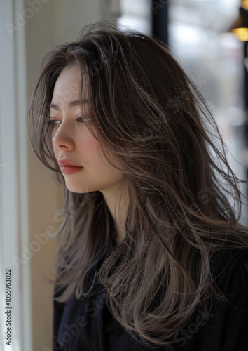 20-year-old Japanese woman side profile ash-beige hair prone in beauty salon photo