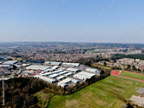 aerial view of mixed land use showing sports fields next to an industrial estate with residential housing in the background photo