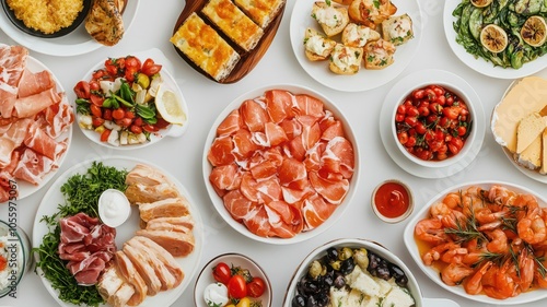 Delicious spread of assorted appetizers on a white table.