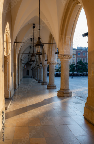 Arcade in Cloth Hall (Sukiennice) in Krakow, Poland durign golden hour photo