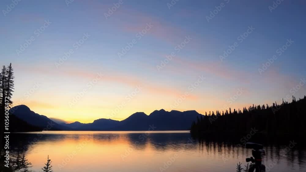 A lake nestled in the mountains at dawn, with the sun rising over a national park, creating a stunning natural landscape. A lake nestled in the mountains at dawn, with the sun rising over a national park, creating a stunning natural landscape.