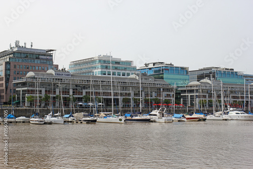 The boats standing in the harbor of Buenos Aires with skyscrapers in the background