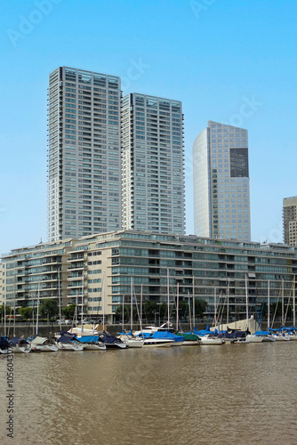 The boats standing in the harbor of Buenos Aires with skyscrapers in the background