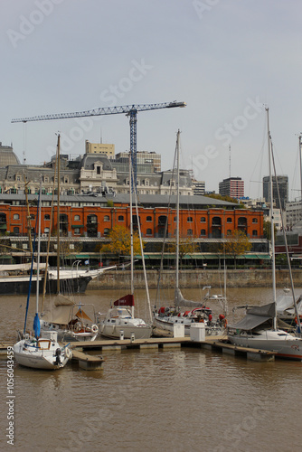 The boats standing in the harbor of Buenos Aires with skyscrapers in the background