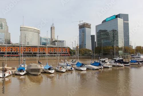 The boats standing in the harbor of Buenos Aires with skyscrapers in the background