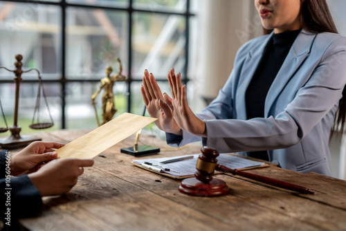 Картината върху платно Lawyer woman is refusing to accept bribe from businessman in law office