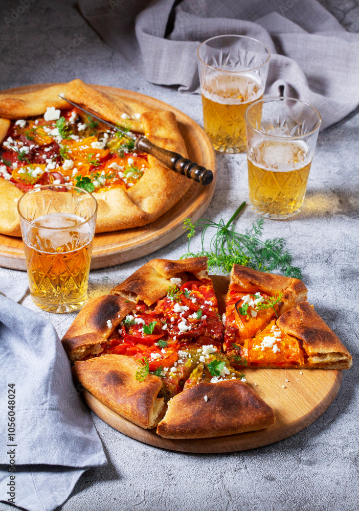 Traditional open pie galette with tomatoes, cheese and herbs, served with beer or wine.