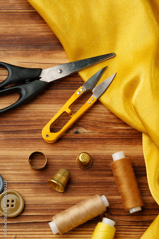 Crafting tools and materials arranged on a wooden table ready for sewing and creative projects Crafting tools and materials arranged on a wooden table ready for sewing and creative projects