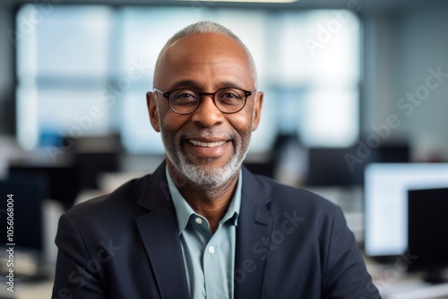 Smiling portrait of a senior African American businessman in modern office