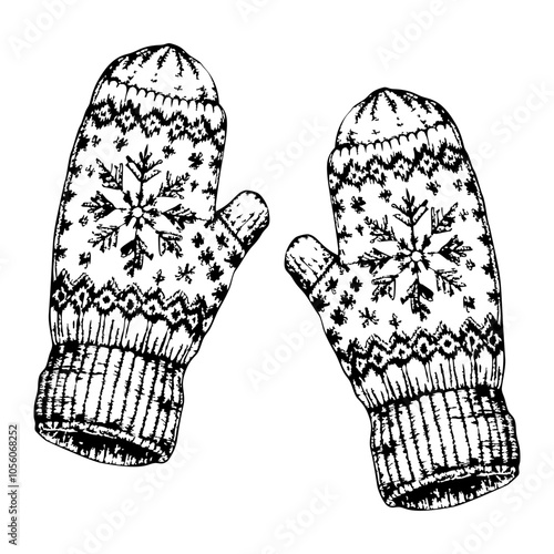 Two mittens with snowflakes on them