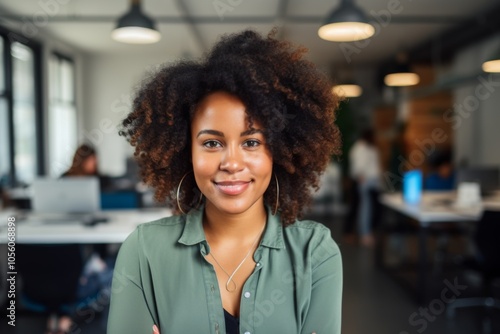 Smiling portrait of a young hipster African American woman in office