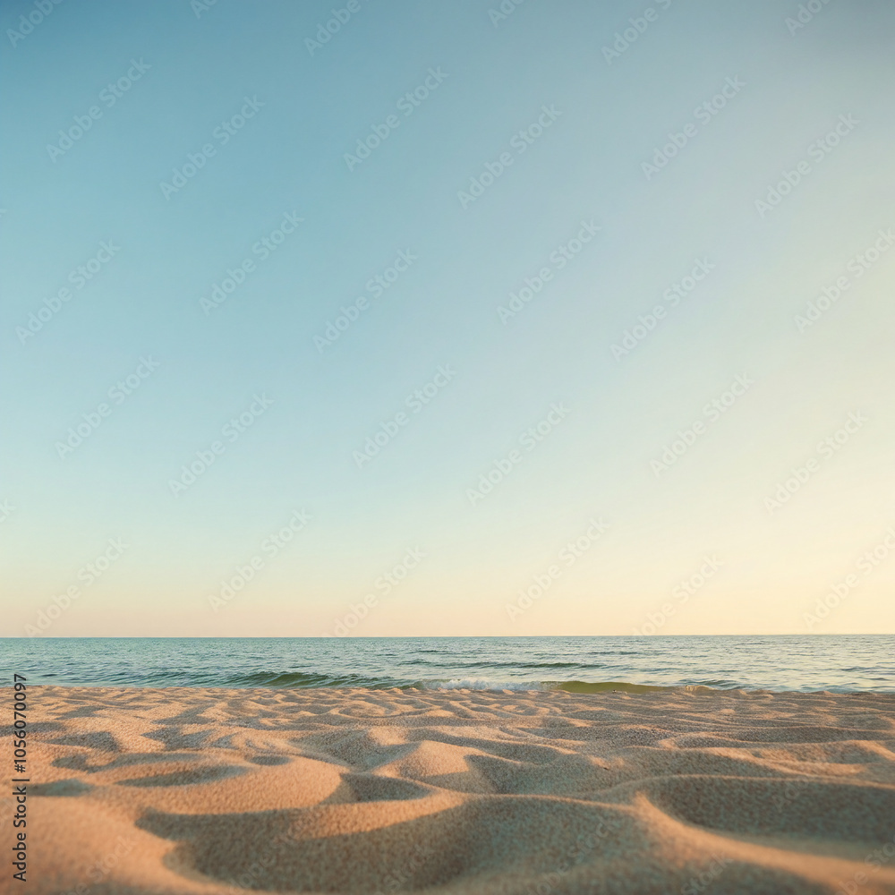 Obraz premium Sandy beach with calm water vast ocean with clear blue sky horizon serene landscape copy space for text