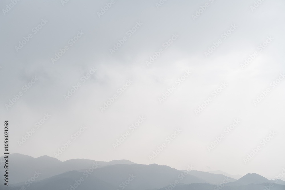 misty sky above mountain peaks – serene landscape with soft layers and a moody, atmospheric view misty sky above mountain peaks – serene landscape with soft layers and a moody, atmospheric view