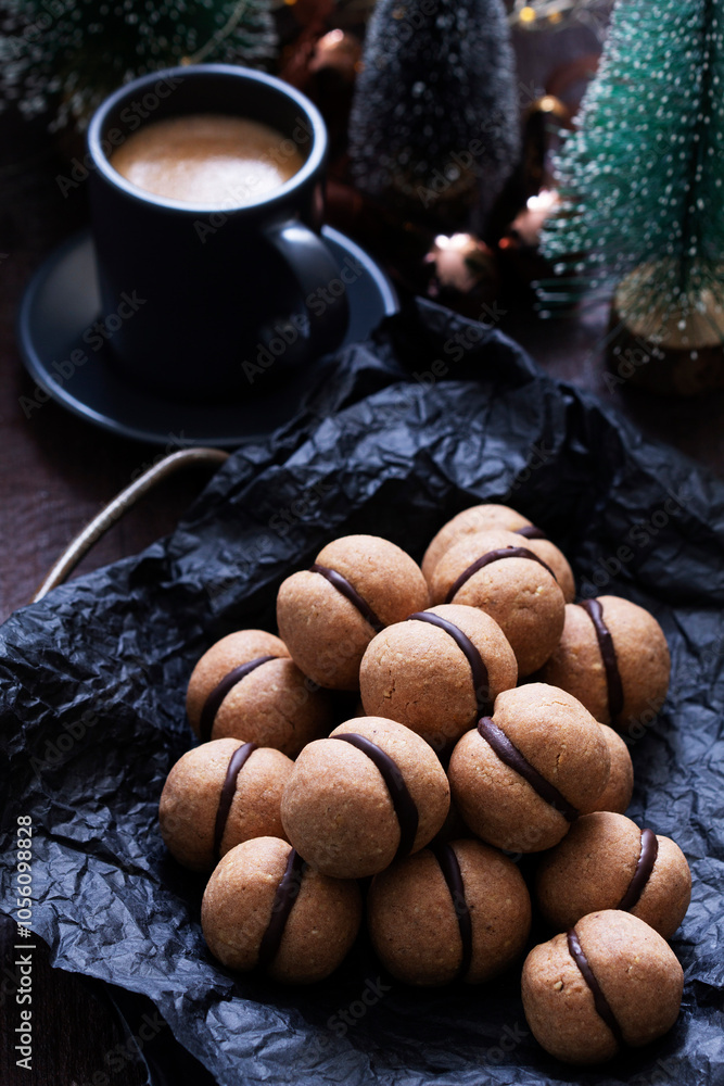 Lady's kisses, traditional Italian nut cookies with coffee and chocolate filling.