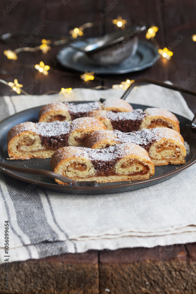 Grandfather's mustache cookies made from shortcrust pastry filled with nuts, jam and cocoa, Christmas toys and garland.