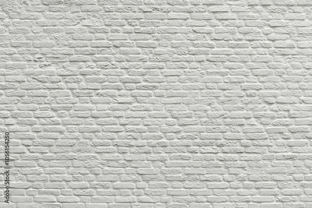 White brick wall as texture or background. An example of masonry as a cladding of external walls. White brick wall as texture or background. An example of masonry as a cladding of external walls.