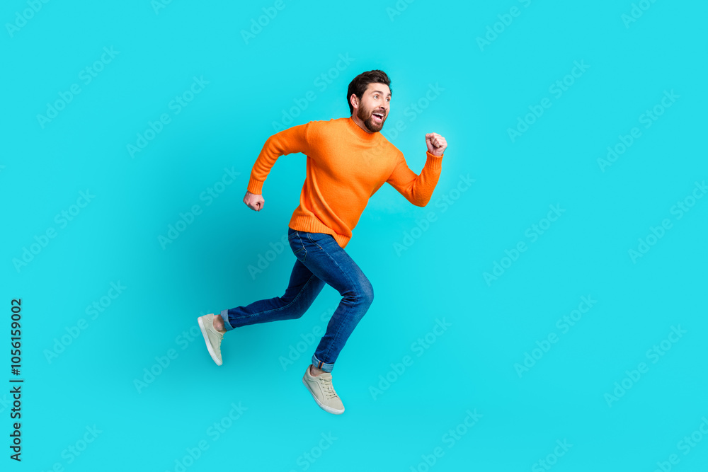 Photo of cheerful funky nice man wear stylish clothes jump up run empty space isolated on cyan color background Photo of cheerful funky nice man wear stylish clothes jump up run empty space isolated on cyan color background