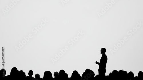 Speaker presenting to an audience silhouette against a blank background at a conference