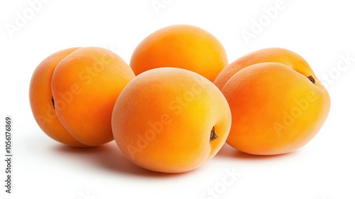 Fresh apricots with fuzzy skin on white background