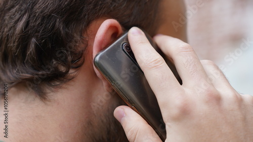 A man is talking on the phone