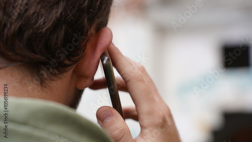 A man is talking on the phone