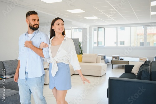 Married couple in the shop choosing furniture