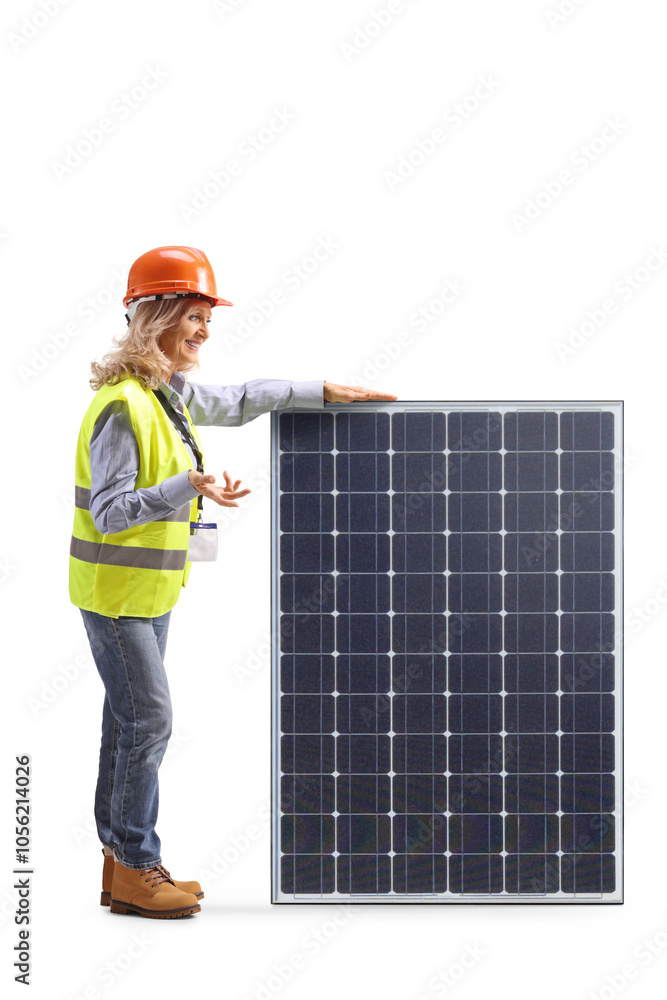 Female engineer standing next to a solar panel and talking Female engineer standing next to a solar panel and talking