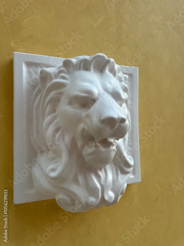 lion statue on the wall photo