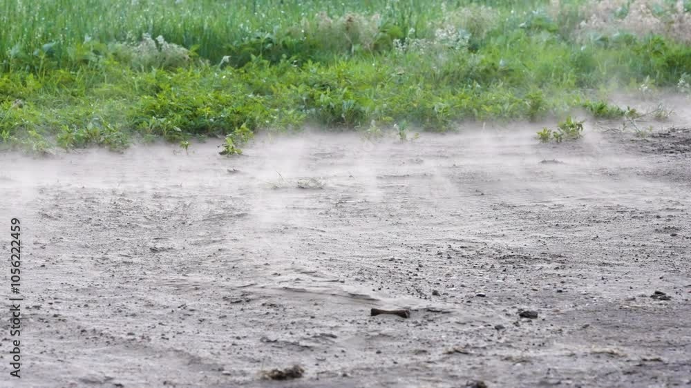 Dust swirling and blowing across the ground. Dust swirling and blowing across the ground.