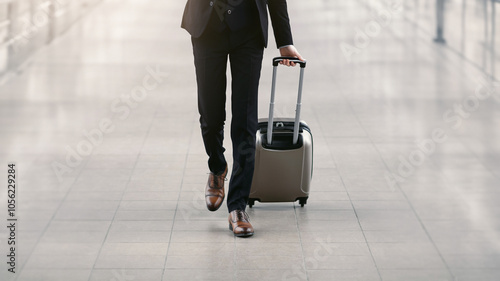 Business Trip Concept. Unrecognizable Businessman Moving To Terminal Gate At Airport, Front View. Free space