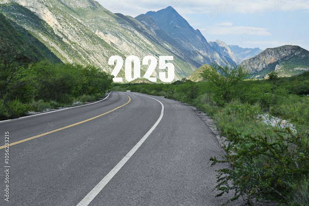 Fototapeta premium Asphalt road leading to 2025 sign. Concept of new year, fresh beginning
