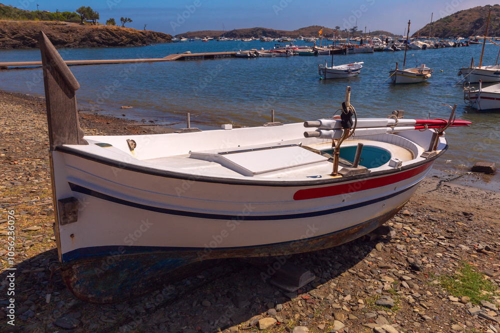 Traditional fishing boat on the shore in Port Lligat, Cadaques, Spain Traditional fishing boat on the shore in Port Lligat, Cadaques, Spain