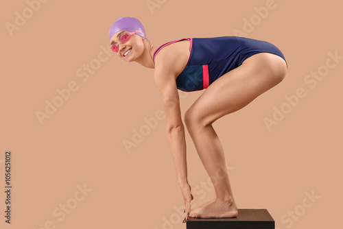 Happy young female swimmer ...