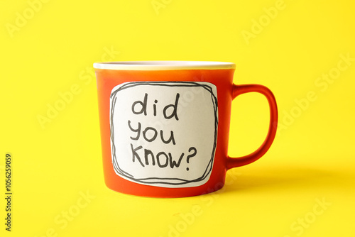 Cup with question DID YOU KNOW? on yellow background. Gossip concept photo