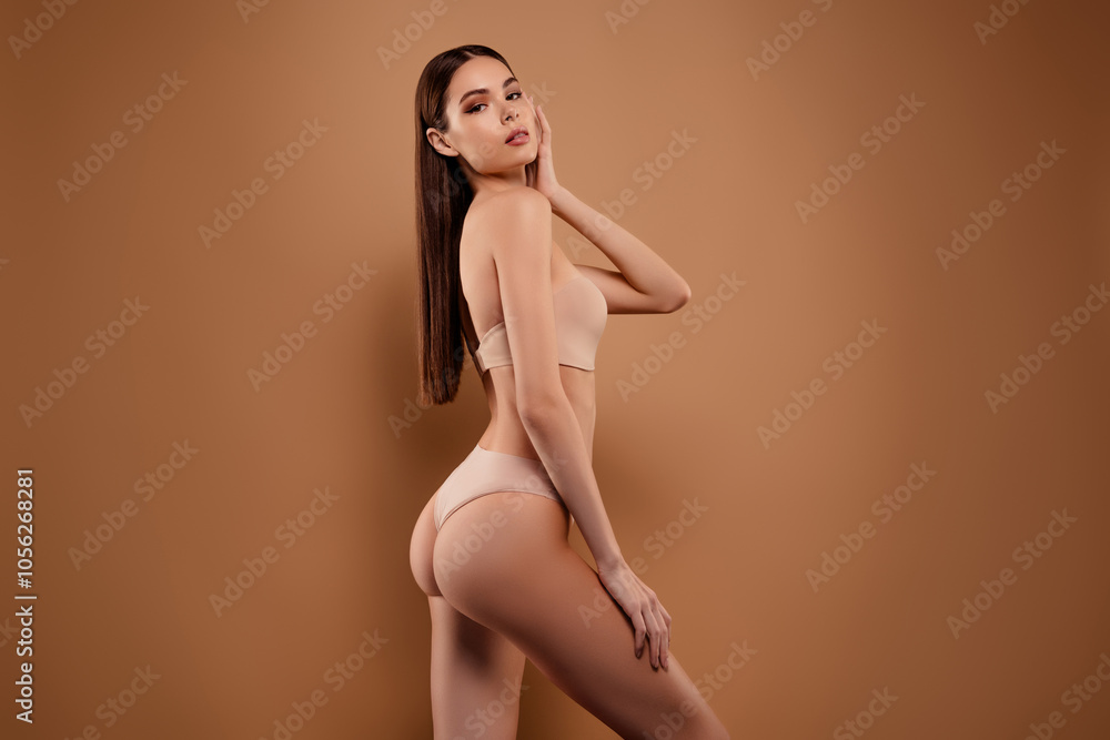Photo of sexy shiny lady wear lingerie enjoying self acceptance emtpy space isolated brown color background Photo of sexy shiny lady wear lingerie enjoying self acceptance emtpy space isolated brown color background