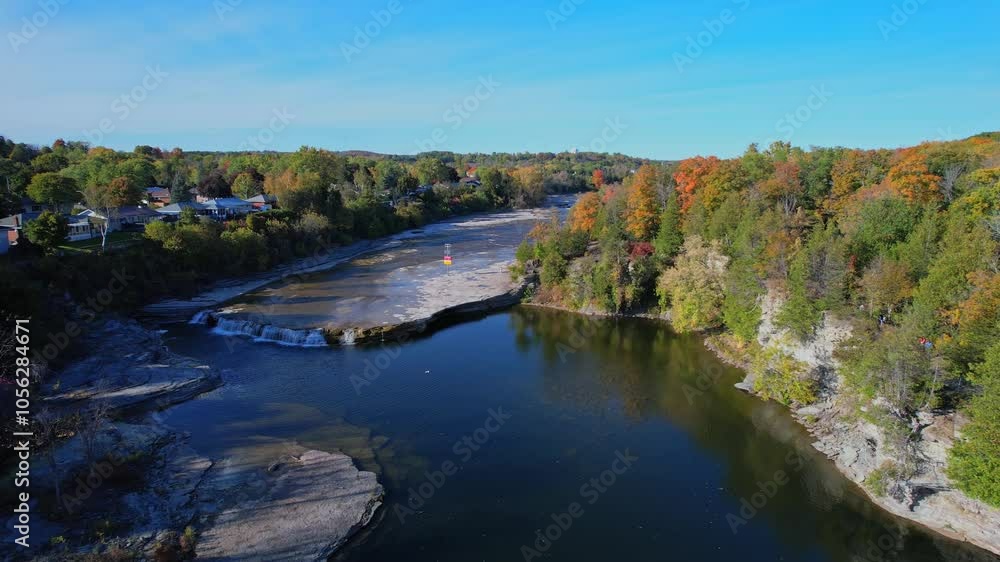 Aerial view from above at north of Trent River falls in Campbellford town. Trent River in southeastern Ontario flows from Rice Lake into the Bay of Quinte on Lake Ontario. Trent-Severn Waterway. Aerial view from above at north of Trent River falls in Campbellford town. Trent River in southeastern Ontario flows from Rice Lake into the Bay of Quinte on Lake Ontario. Trent-Severn Waterway.