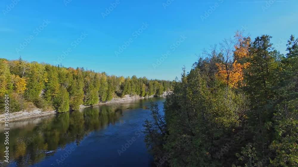 View at south of Trent River falls from Ranney Gorge Suspension Bridge in Campbellford town. Trent River in southeastern Ontario flows from Rice Lake into the Bay of Quinte on Lake Ontario. View at south of Trent River falls from Ranney Gorge Suspension Bridge in Campbellford town. Trent River in southeastern Ontario flows from Rice Lake into the Bay of Quinte on Lake Ontario.