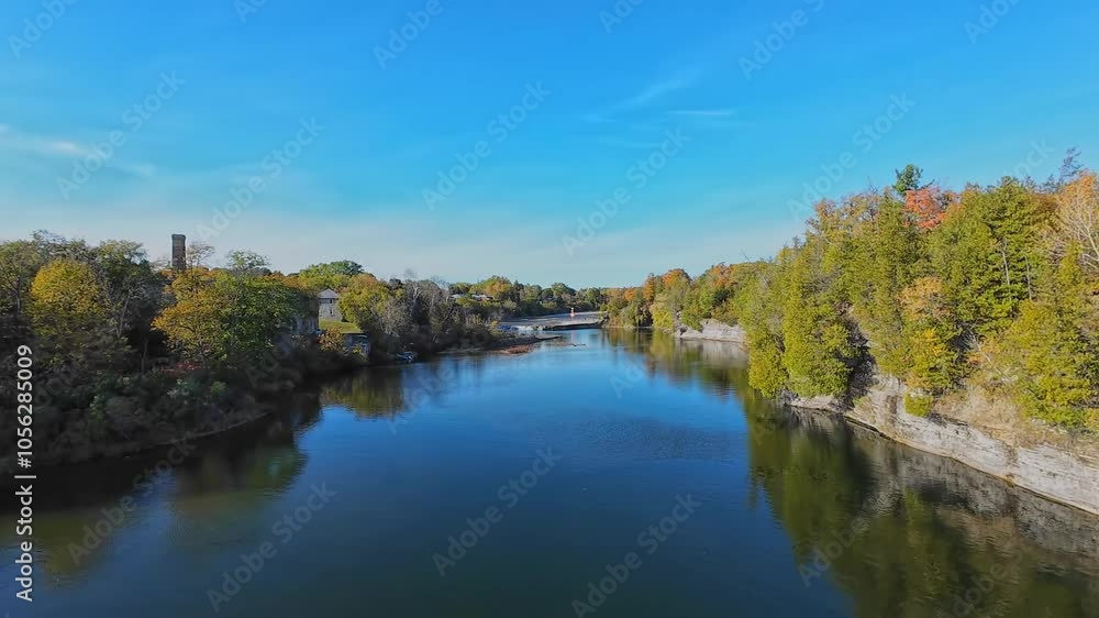 View at north of Trent River falls from Ranney Gorge Suspension Bridge in Campbellford town. Trent River in southeastern Ontario flows from Rice Lake into the Bay of Quinte on Lake Ontario. View at north of Trent River falls from Ranney Gorge Suspension Bridge in Campbellford town. Trent River in southeastern Ontario flows from Rice Lake into the Bay of Quinte on Lake Ontario.