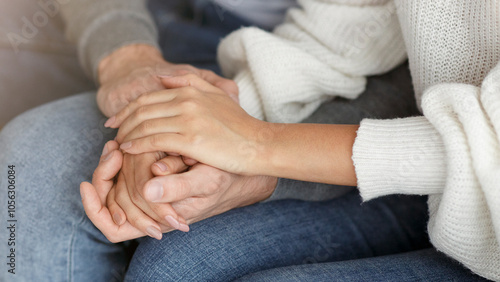 Happy Reconciliation. Unrecognizable Couple Holding Hands Sitting On Couch During Family Therapy Session Indoor. Cropped, Selective Focus