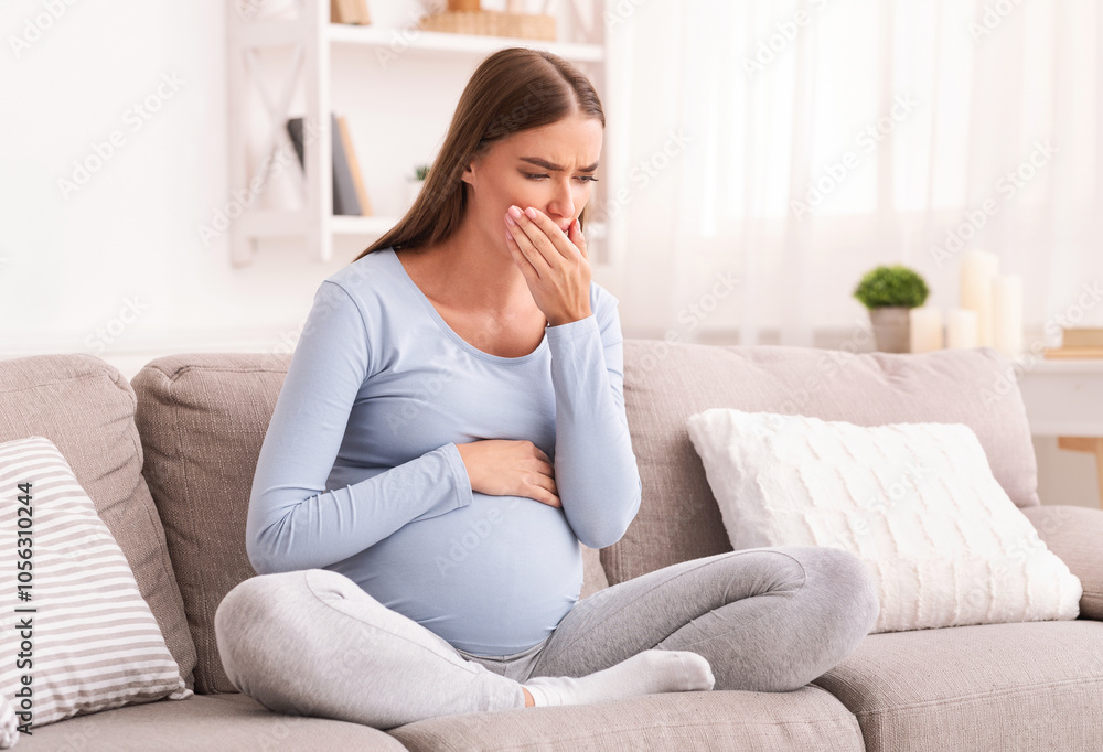 Morning Sickness. Pregnant Girl Feeling Sick Touching Mouth Sitting On Couch Indoor. Empty Space For Text Morning Sickness. Pregnant Girl Feeling Sick Touching Mouth Sitting On Couch Indoor. Empty Space For Text