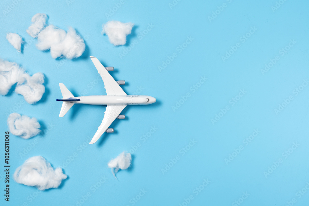 Model airplane flying through cotton clouds Model airplane flying through cotton clouds