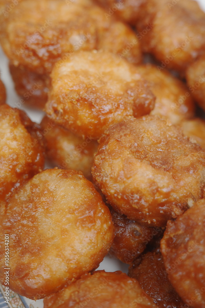 Bitso Bitso, a Filipino delicacy made with fried rice flour dough then coated with coconut cream and muscovado sugar syrup.