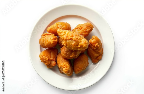 Top view of fried chicken meal in a white plate isolated on white background