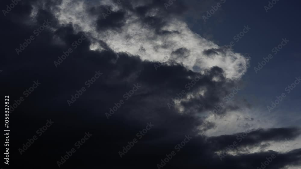 Time lapse of storm clouds covering the sun with a blue sky Time lapse of storm clouds covering the sun with a blue sky