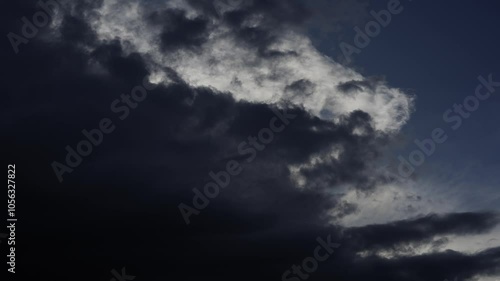 Time lapse of storm clouds covering the sun with a blue sky photo