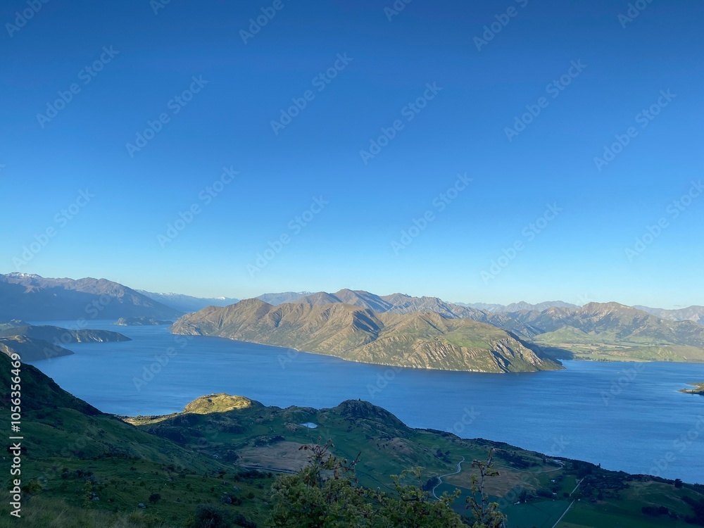 Beautiful landscapes of Lake Wanaka from Mount Roy, Roys Peak, Wanaka, South Island, New Zealand. Landscape with mountains and sky Beautiful landscapes of Lake Wanaka from Mount Roy, Roys Peak, Wanaka, South Island, New Zealand. Landscape with mountains and sky